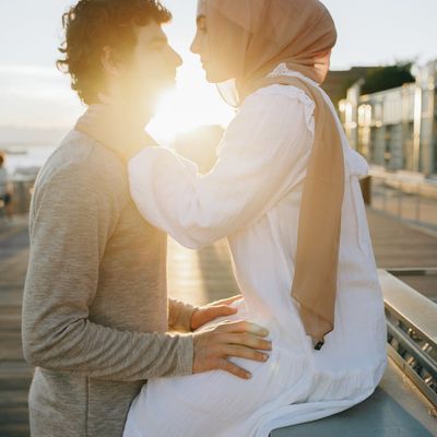 Silhouette of a person sitting peacefully, with a soft, dusty light.